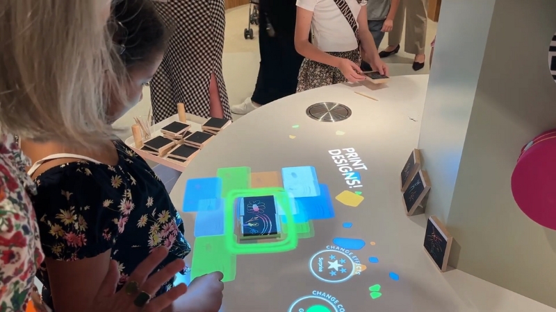 Image of children interacting with a digital display at the Met Kids interactive studio