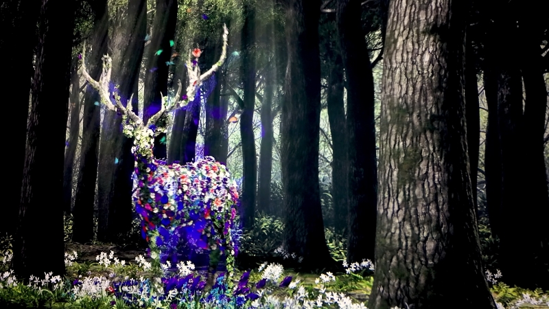 An augmented reality display shows a colorful, flower-covered deer standing in a forest setting